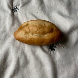 silly load of bread shaped coin purse